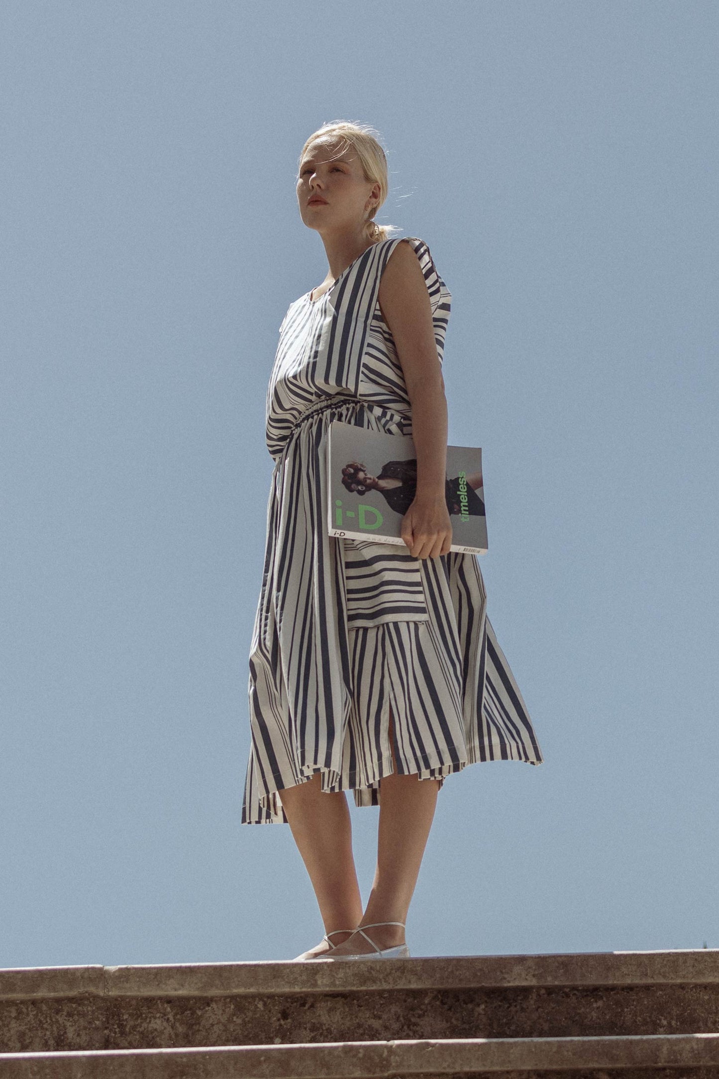 Model wearing 10 to 10  striped white and blue skirt and top