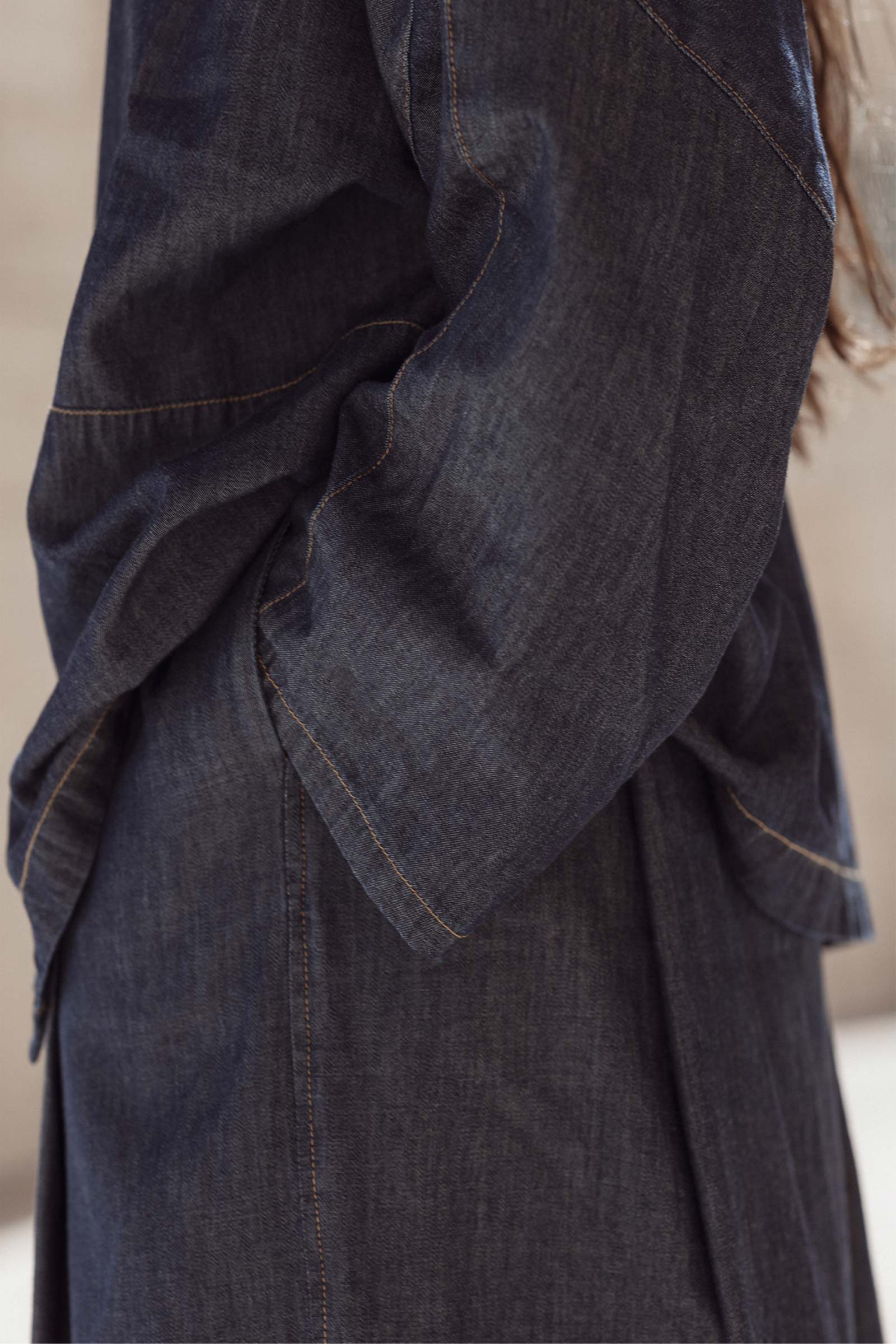 Close up details of 10 to 10 denim trousers and shirt